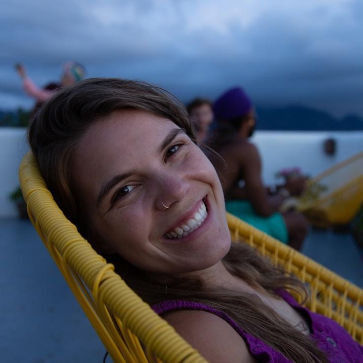 Ari Patel, Lead Design Curator at Calm River Stories, reviewing corporate floral arrangements